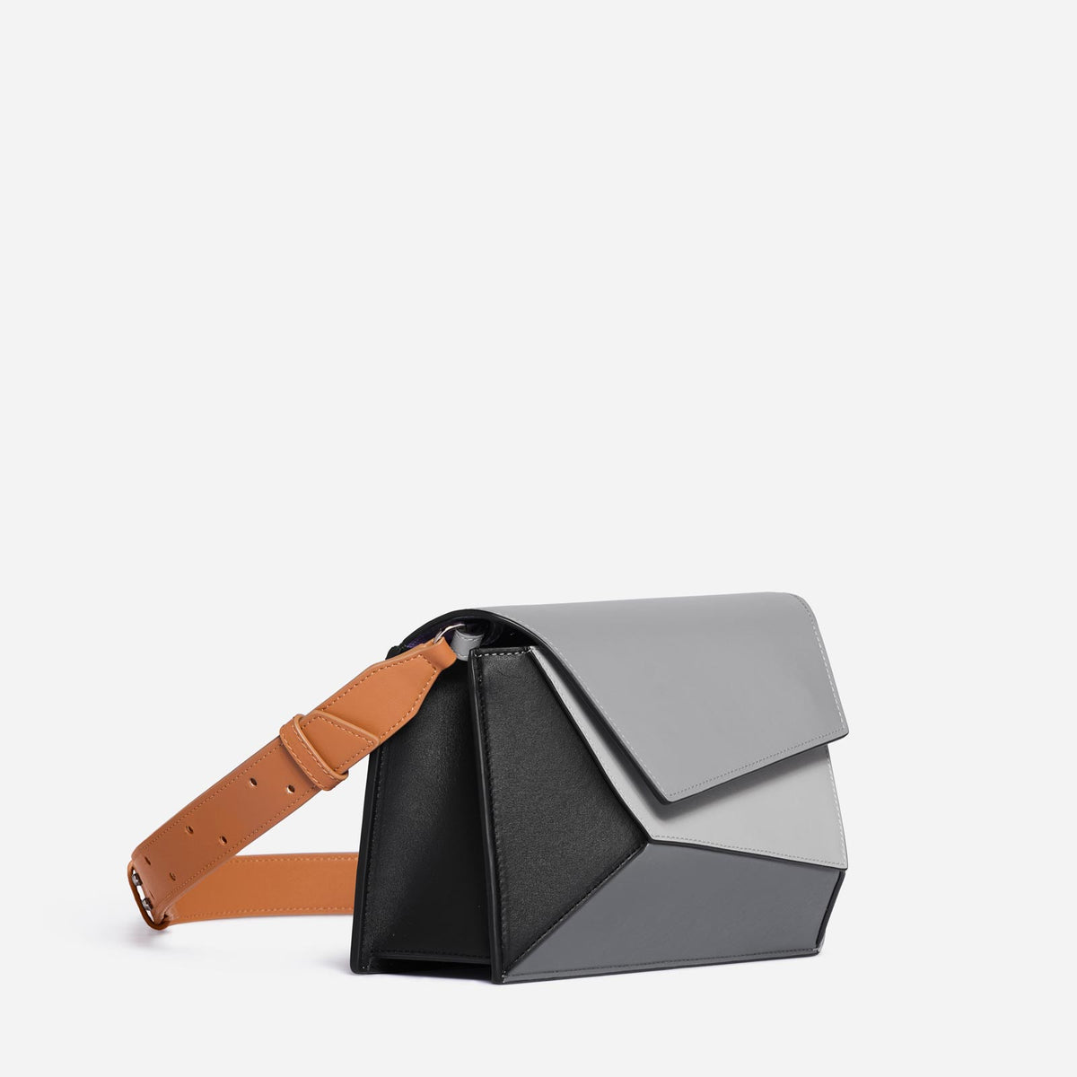 Polygon-shaped duffle bag in black leather